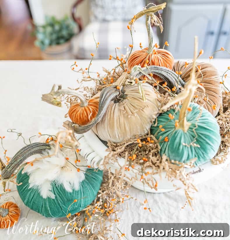 Twists of paper and dried berries on branches are in the centerpiece.