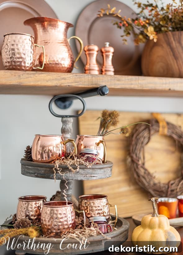 Open shelves decorated for fall with copper accessories.