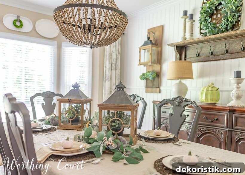 Casually Elegant Fall Dining Room Decor Ideas 4 fall centerpiece with eucalyptus garlands and velvet pumpkins