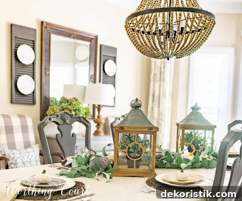 Casually Elegant Fall Dining Room Decor Ideas 5 fall centerpiece with eucalyptus garlands and velvet pumpkins