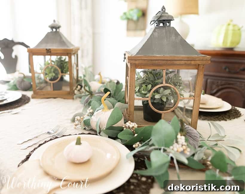 Casually Elegant Fall Dining Room Decor Ideas 6 eucalyptus garland and velvet pumpkin fall centerpiece