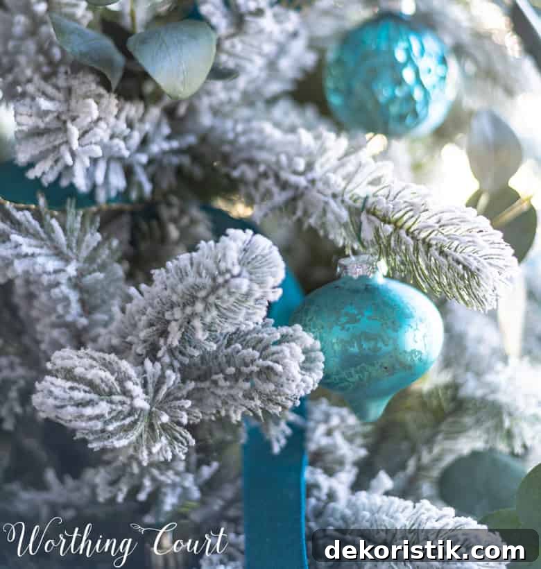 Up close look of the flocking on the tree and the teal ornaments.