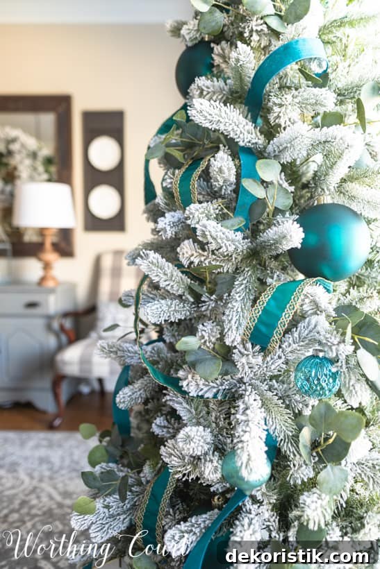 Flocked Christmas tree decorating ideas in the dining room.