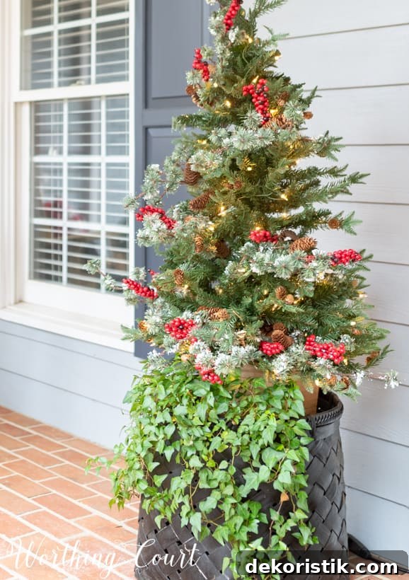 Up close picture of the basket at the front door with a Christmas tree in it.