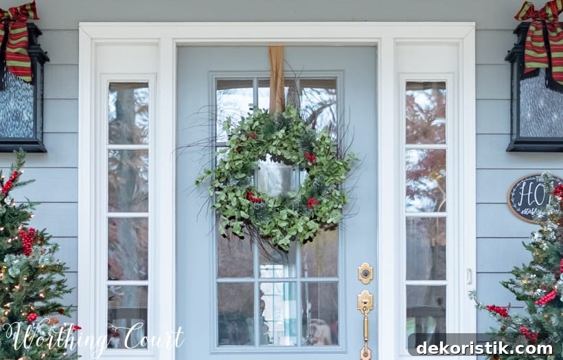 There are bows on the light fixtures on either side of the door.