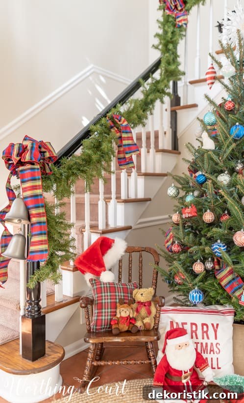 Front porch holiday display with matching garland and ornaments