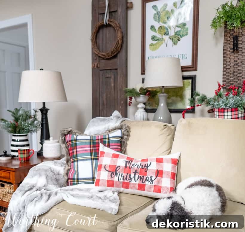 Cute dog on a sofa with Christmas pillows.