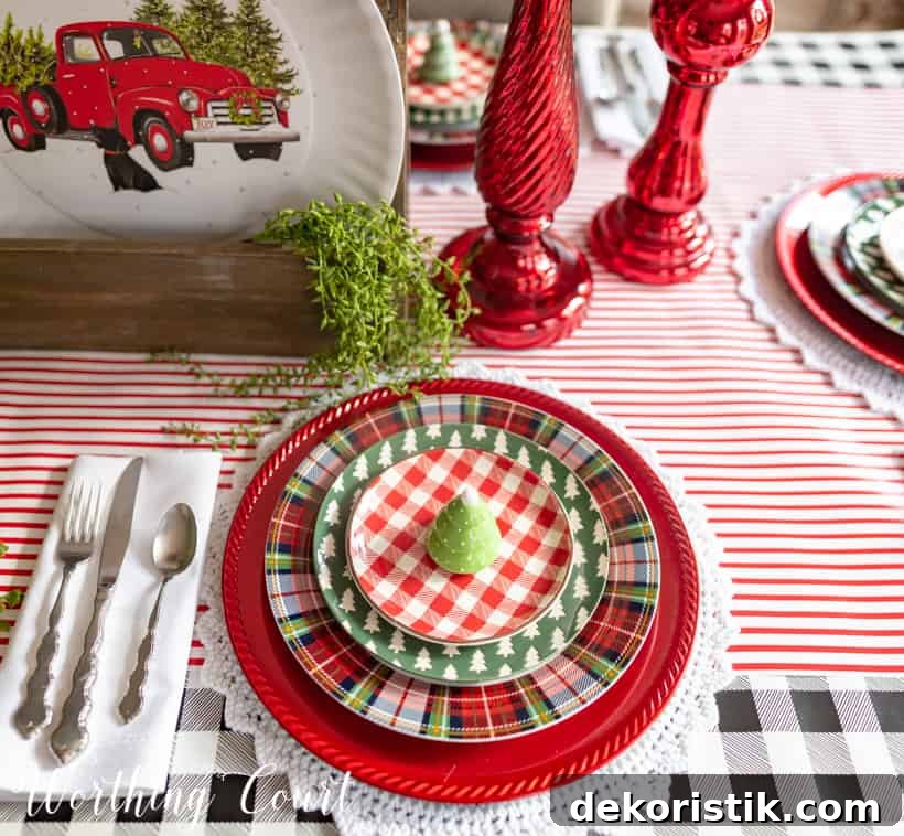 Red, green and white Christmas table setting with christmas plates.