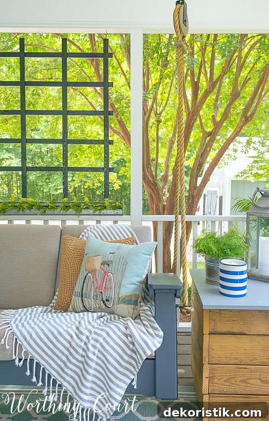 6 Spring Home Decor Items to Refresh Your Space 16 Beach bicycle throw pillow on a porch swing.