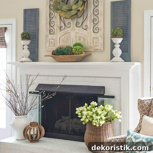 6 Spring Home Decor Items to Refresh Your Space 10 White fireplace decorated for spring.