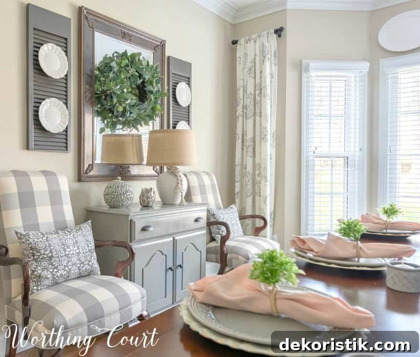 Gray dining room chest and arm chairs.