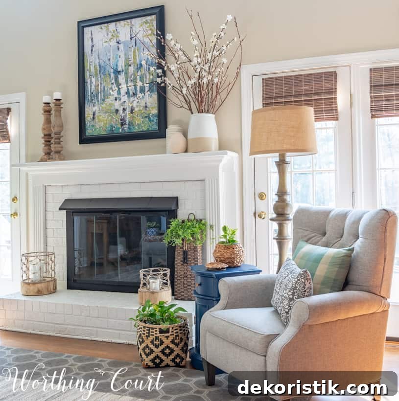 Fireplace brick painted white with candles on the mantle.