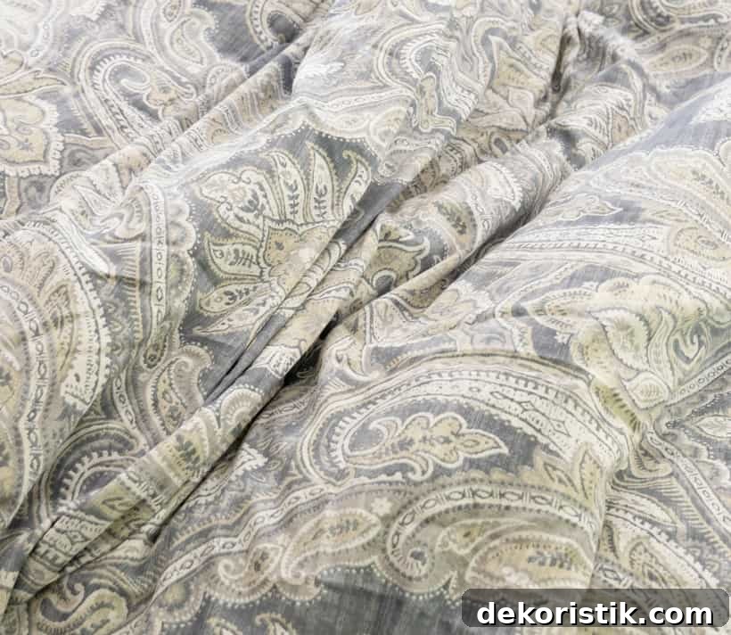 Comforter with gray and off white paisley pattern
