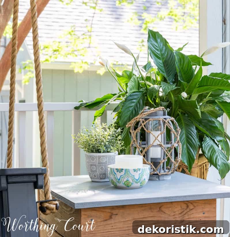 vignette on a side table on a screen porch