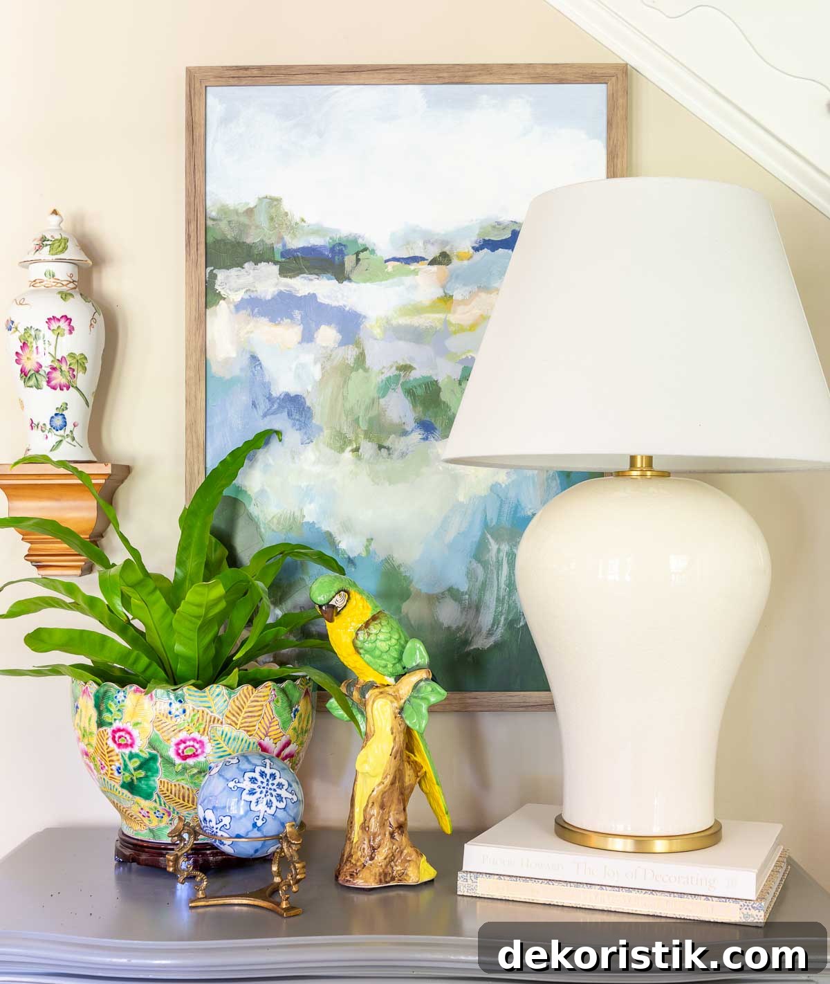 How to Choose the Right Table Lamp and Lampshade Size 2 off white lamp and colorful accessories on top of a small gray chest