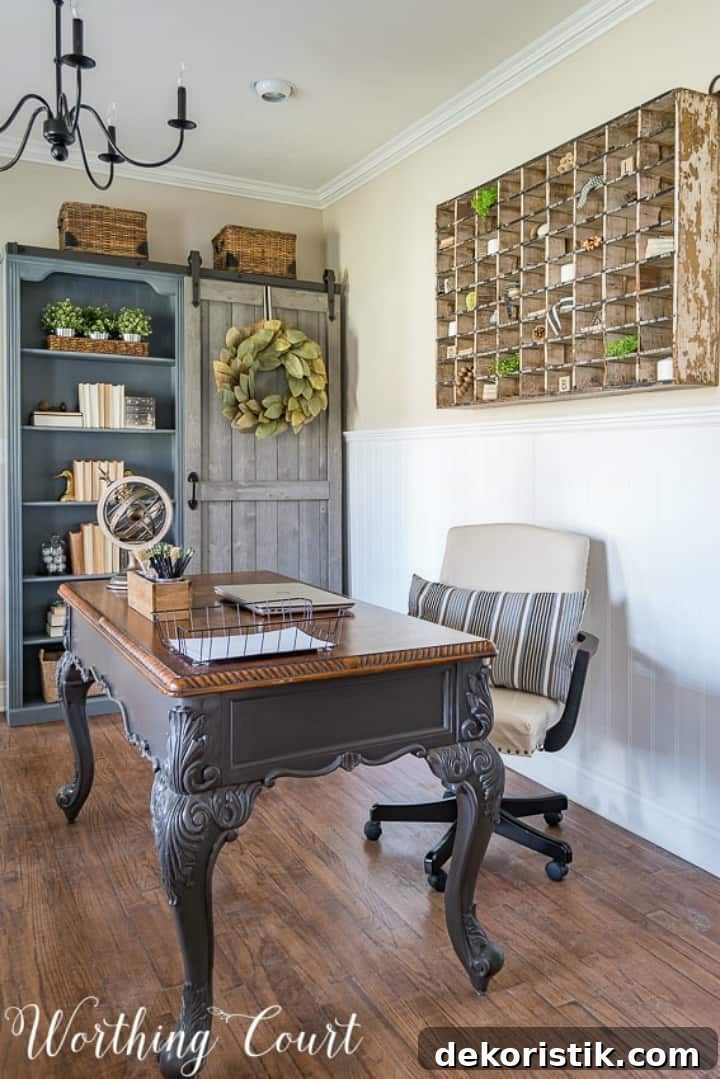 home office with gray bookcase with a sliding door