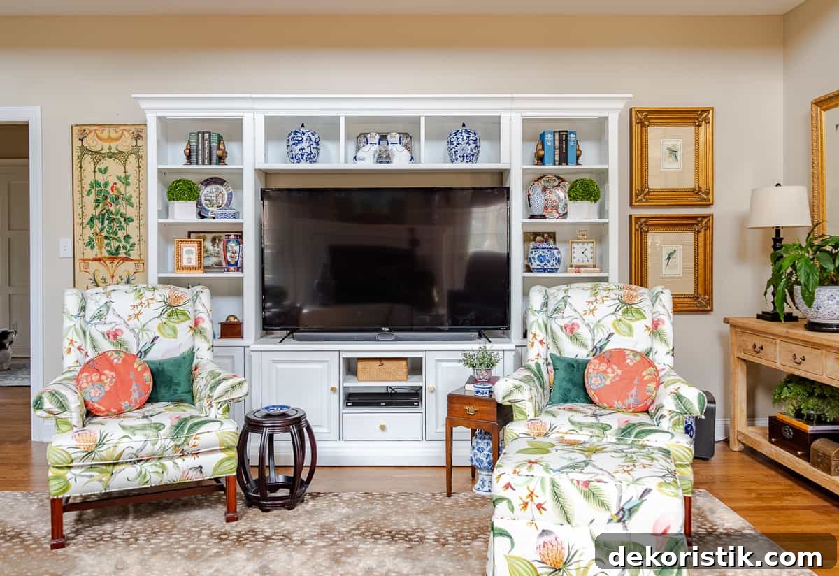 Shelf Decor Ideas: Creative Ways to Style Your Shelves 7 living room decorated for spring with colorful accessories in a white entertainment center with two colorful chairs in front