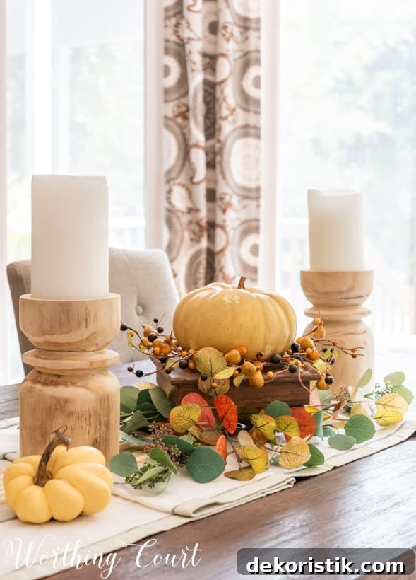 Fall Shelf Decor Ideas for Cozy Breakfast Nook and Centerpiece 8 fall centerpiece with chunky wood candlesticks and faux eucalyptus in fall colors