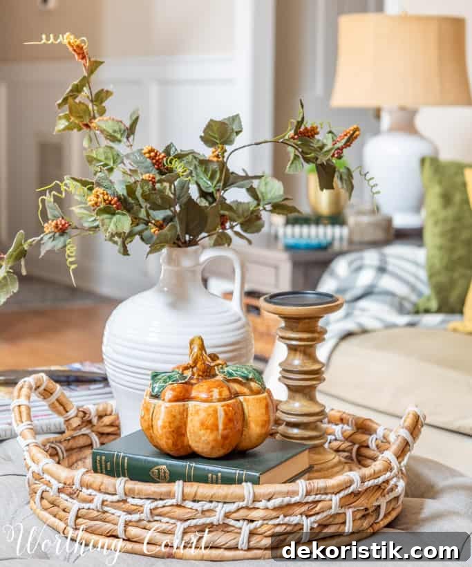 round wicker tray holding fall decorations