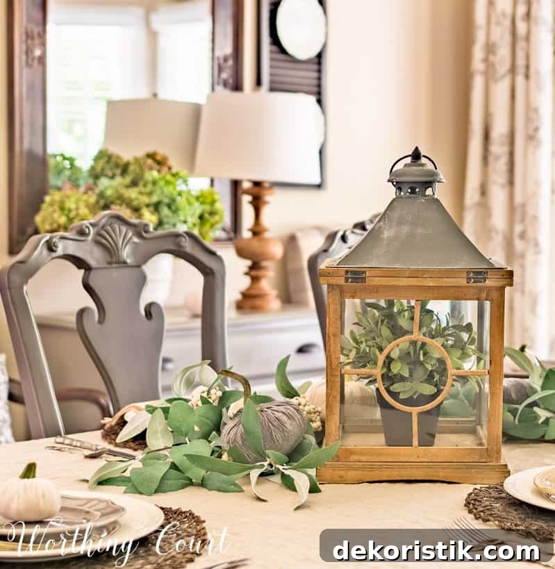 5 Tabletop Accessories to Elevate Your Thanksgiving Table 7 lantern and velvet pumpkin table centerpiece
