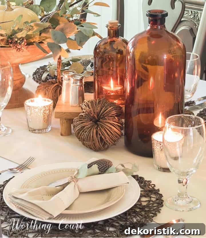 5 Tabletop Accessories to Elevate Your Thanksgiving Table 11 Thanksgiving table set with brown jugs and neutral dinnerware and linens