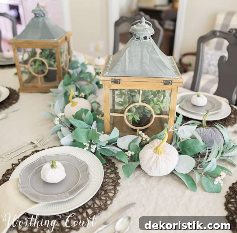 5 Tabletop Accessories to Elevate Your Thanksgiving Table 3 Table set for Thanksgiving with neutral linens and dishes and lanterns