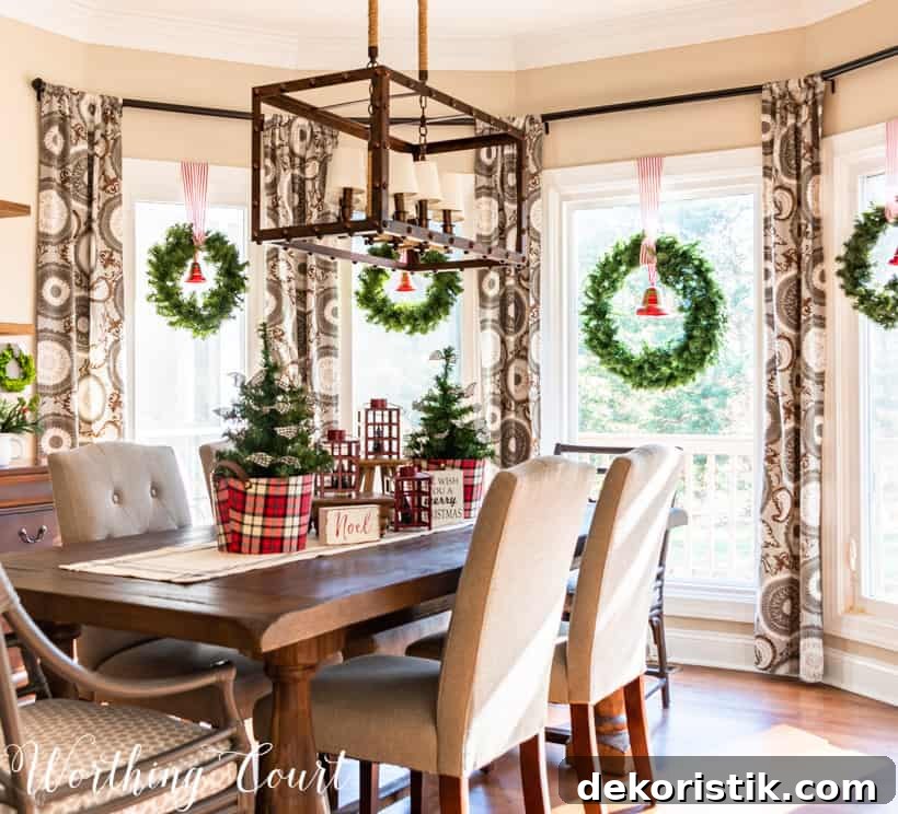 Large bay window with Christmas wreath in each window.