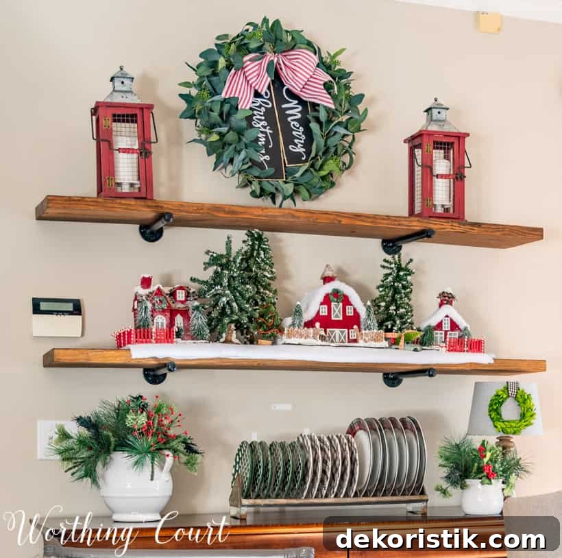 A eucalyptus wreath with a red and white bow on the wooden shelving unit.