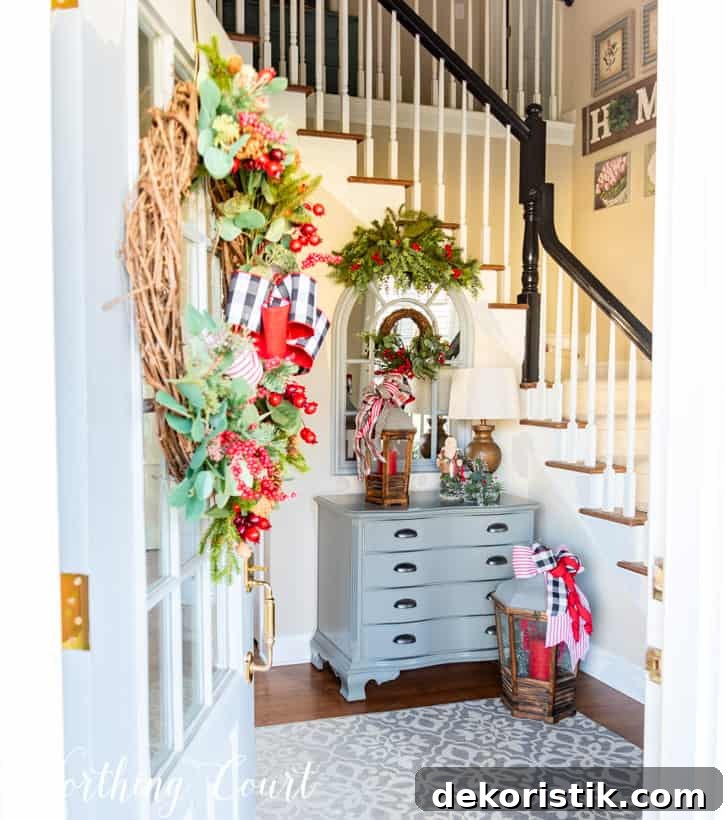 A view from front door looking into foyer decorated for Christmas.