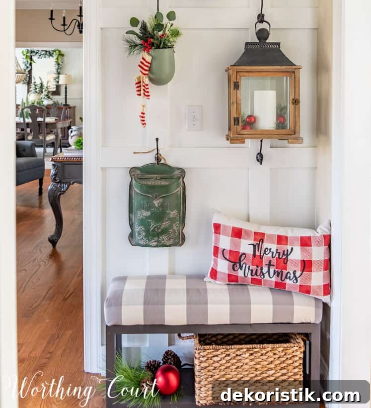 A red and white checkered pillow is in the corner on the bench that says Merry Christmas.