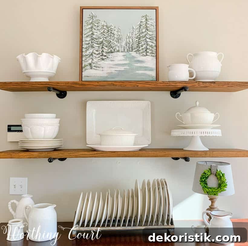 open shelves decorated for winter with white accessories
