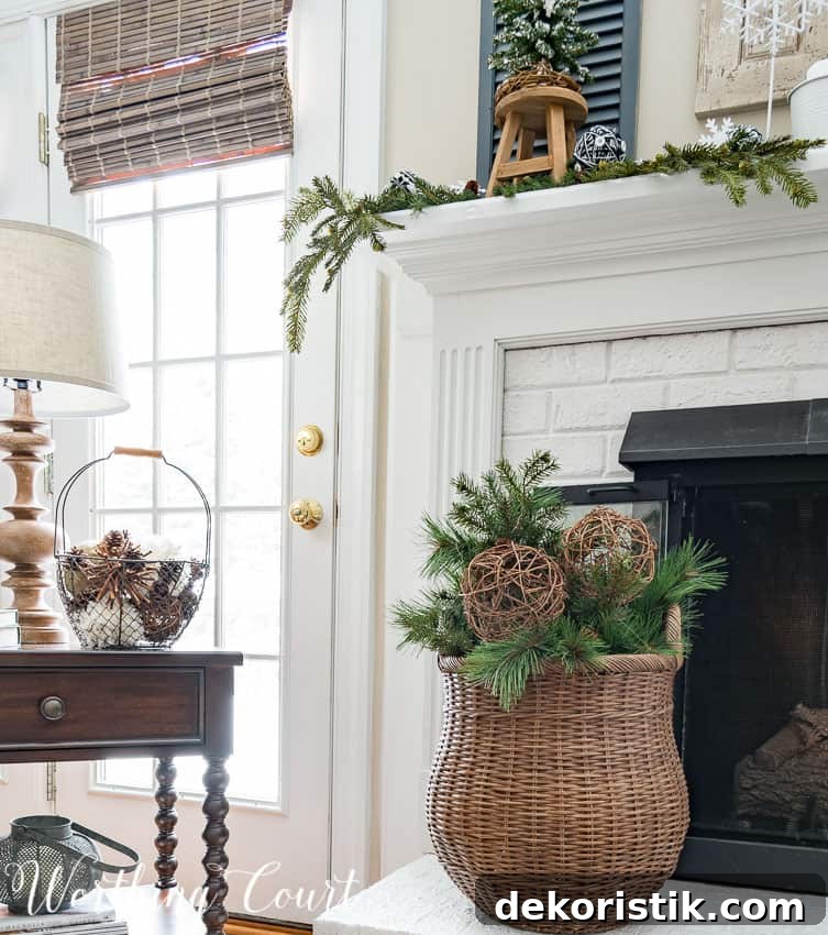 Wicker basket filled with artificial greenery and grapevine orbs for winter