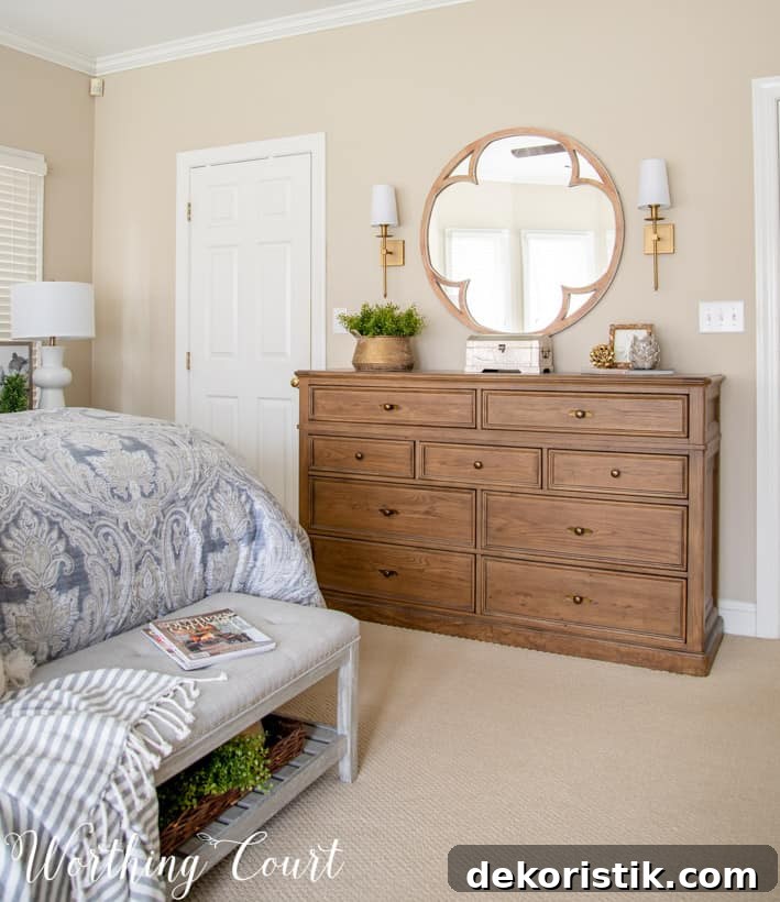 Master Bedroom Makeover: Progress Photos and Timeline 7 dresser with round mirror above flanked with brass sconces