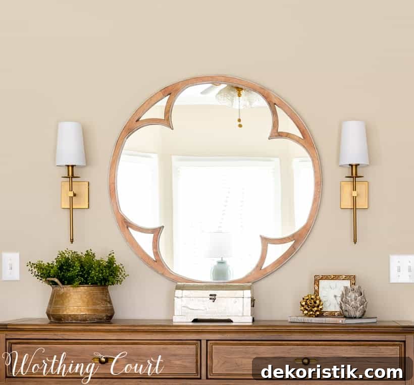 Master Bedroom Makeover: Progress Photos and Timeline 8 round mirror above dresser flanked by brass sconces
