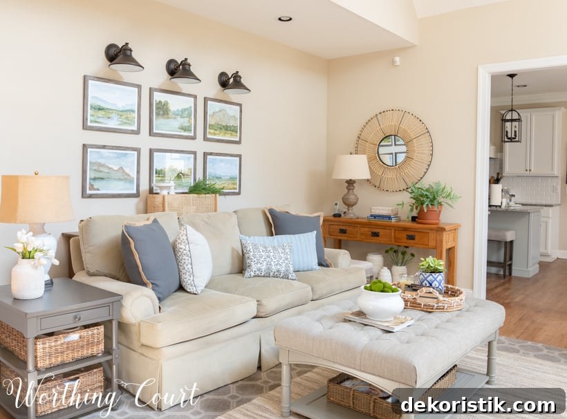Neutral family room sofa and upholstered coffee table.