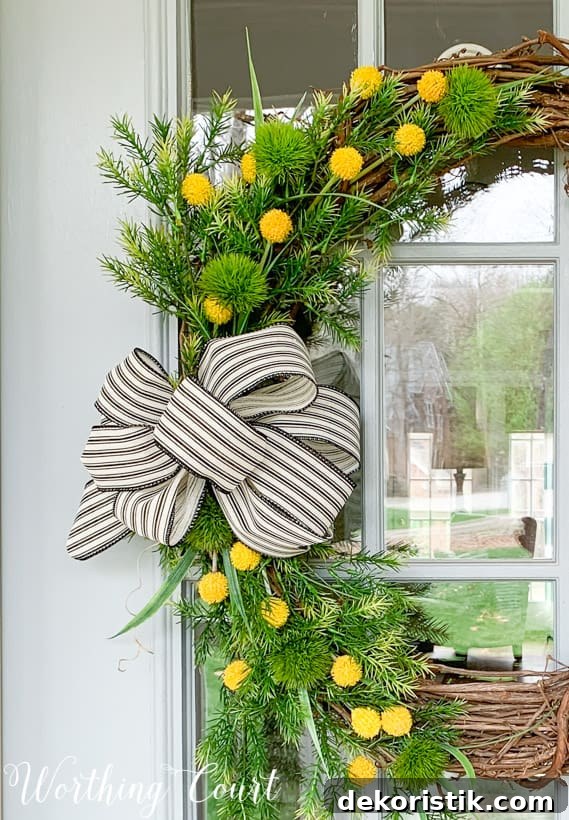 A pretty ribbon bow is on the wreath.