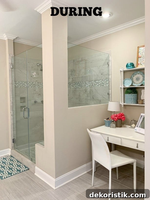 The walls painted an off white and a small makeup area.