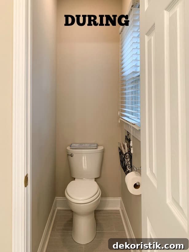 A small toilet area with a door.