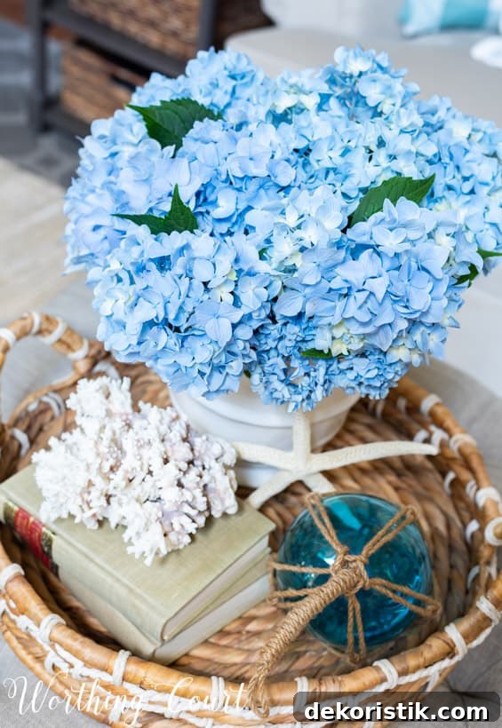 A starfish and coral plus blue glass in the vignette.