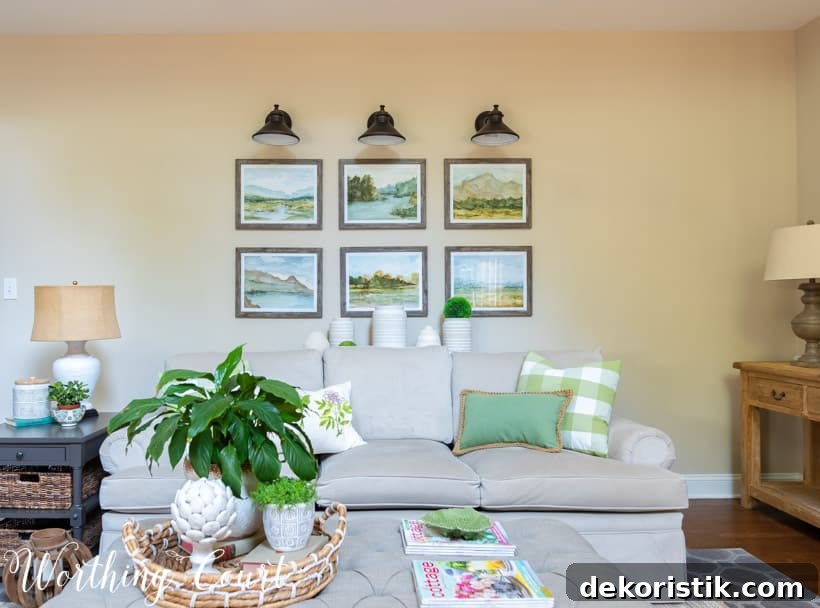 gray sofa with gallery wall above and upholstered coffee table