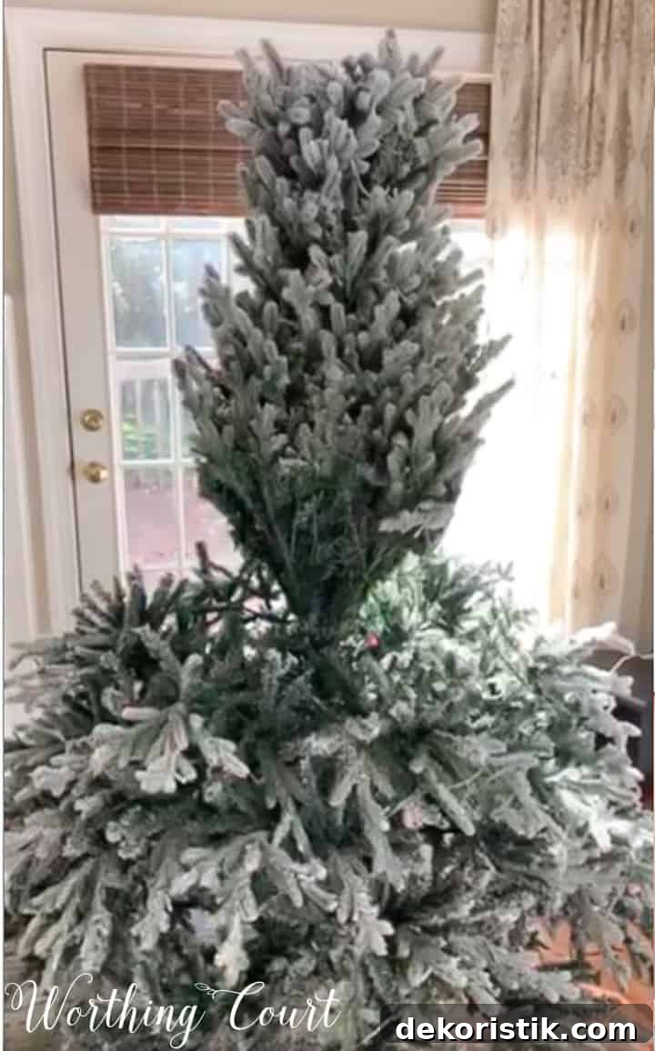 flocked artificial Christmas tree partially put together