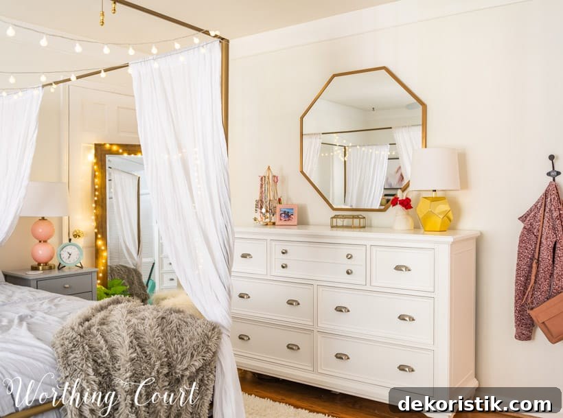 white dresser with octagonal mirror above