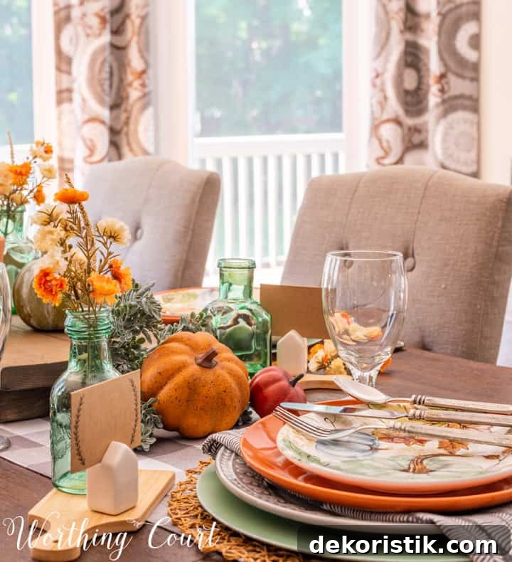 Thanksgiving table set with traditional fall colors and elements