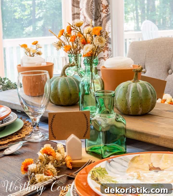 Thanksgiving table set with traditional fall colors and elements