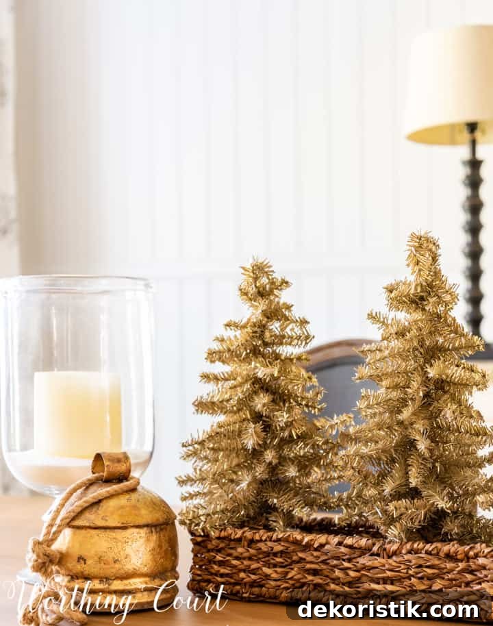 Rustic Christmas Dining Room Decor Ideas for Elegant Tables 5 Christmas centerpiece with tinsel trees in a wicker basket, glass candle holders and a gold bell