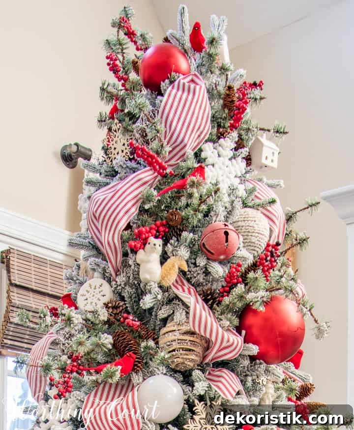 Red and White Flocked Christmas Tree with Snowy Branches 8 flocked Christmas tree with red and white decorations
