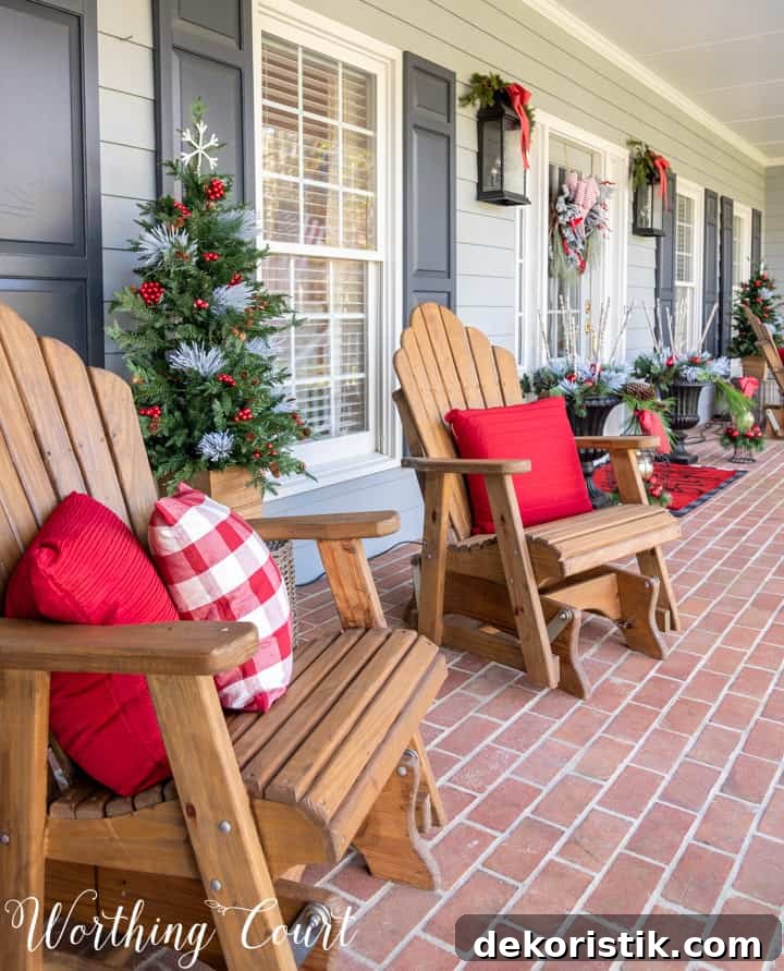 Adirondack chairs on porch with red and white pillows for Christmas
