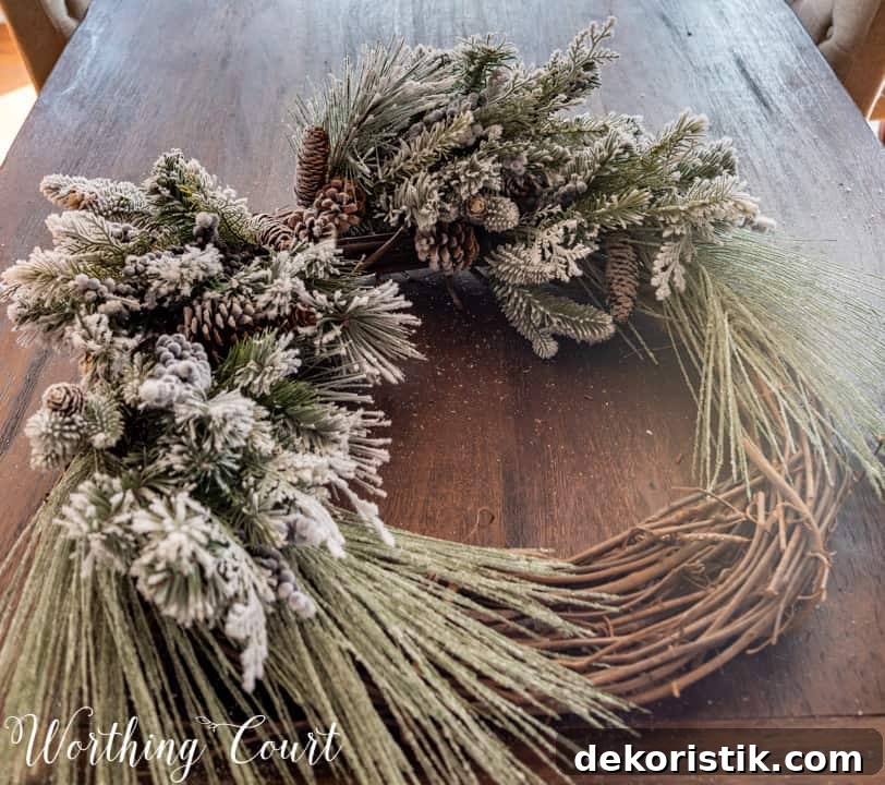 partially assembled Christmas wreath lying on a table