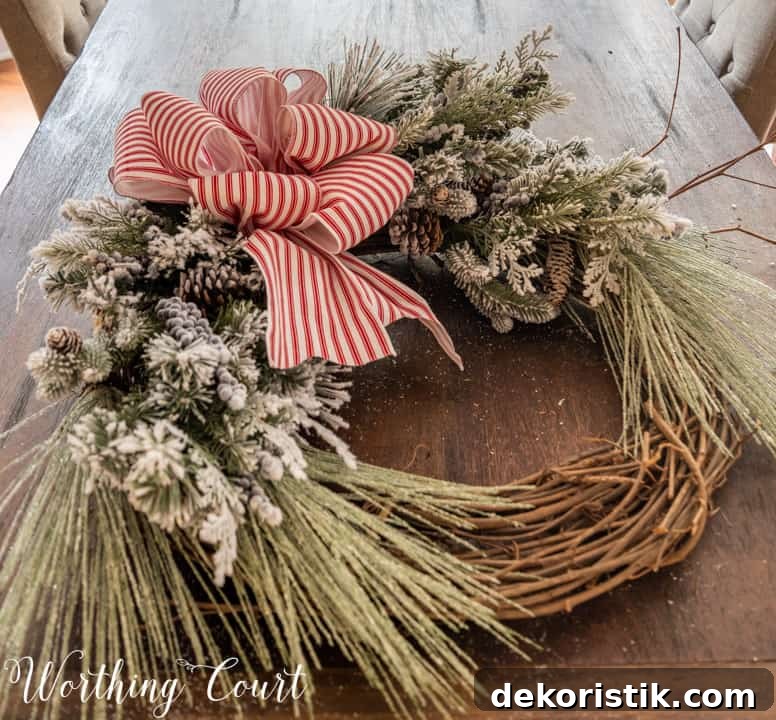 partially assembled Christmas wreath lying on a table