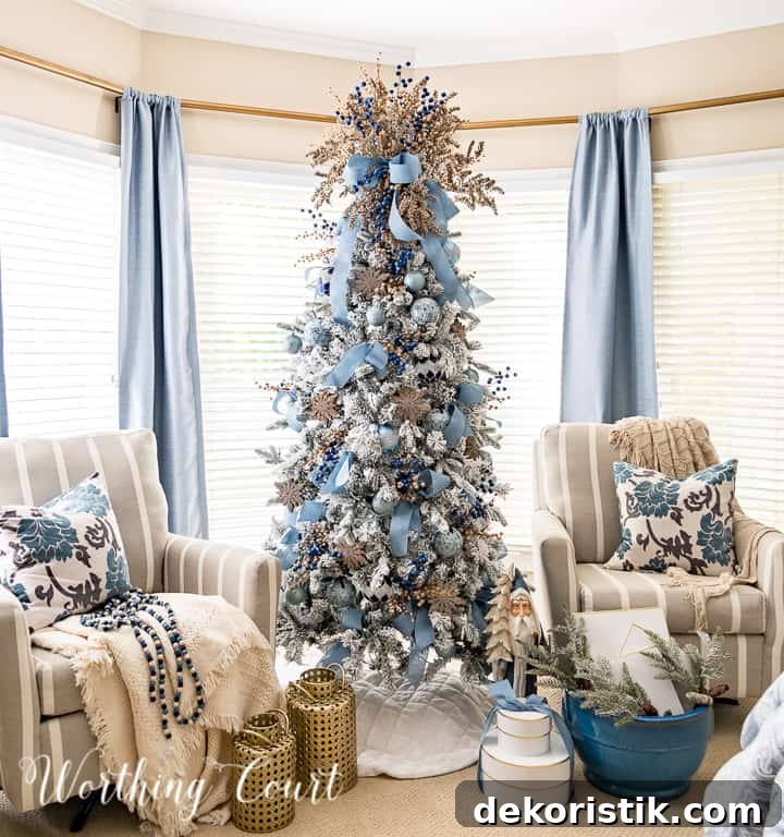 Flocked tree with blue and gold ornaments